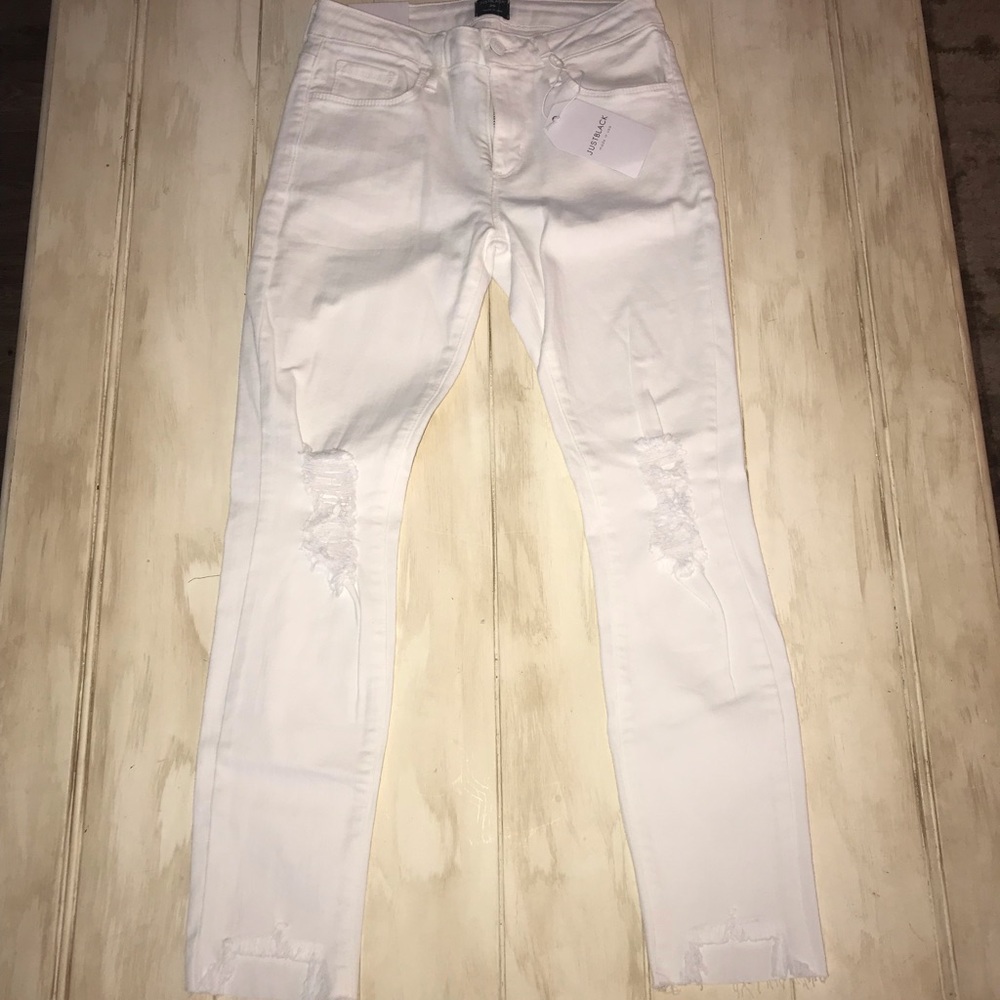 Distressed white crop jeans